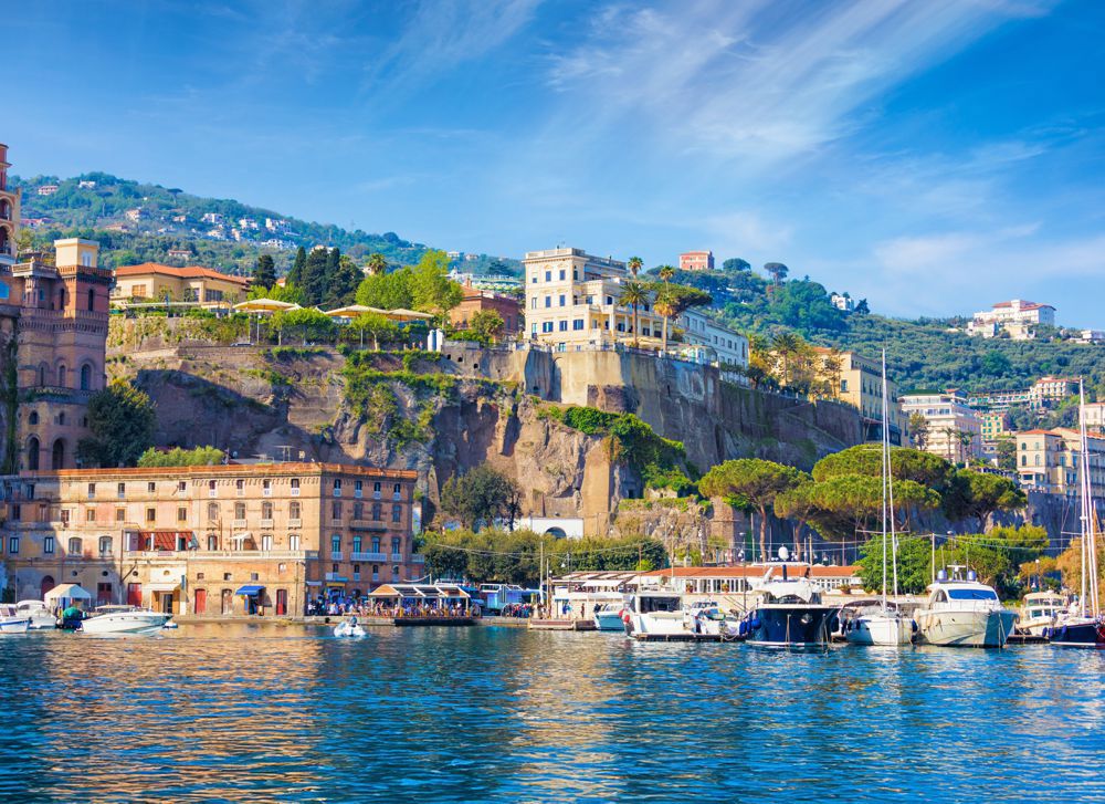 View from sea coastline of Sorrento and Gulf of Naples, Italy. Sea cliffs and luxury hotels of Sorrento attract lot of tourists from all over world.